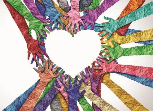 A group of multicolored, crumpled-paper hands arranged in a circle form a heart at the center on a white background, symbolizing unity, diversity, love, and the power of emotional connection in relationships.