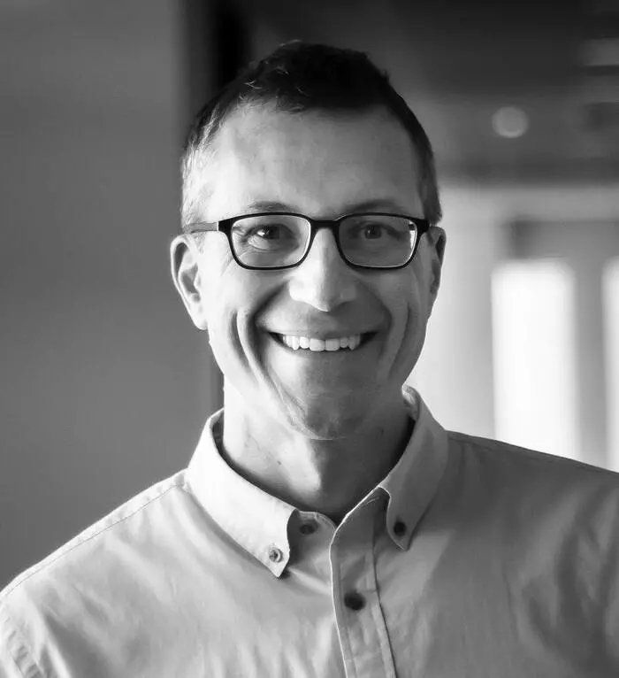 Black-and-white portrait of Ben Garthwaite, CEO of Fors Marsh.